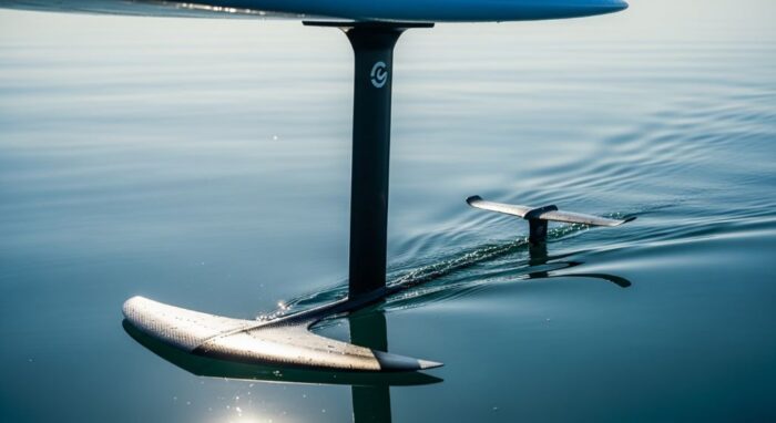 Close-up of a hydrofoil mast and wing attached beneath a surfboard on flat water
